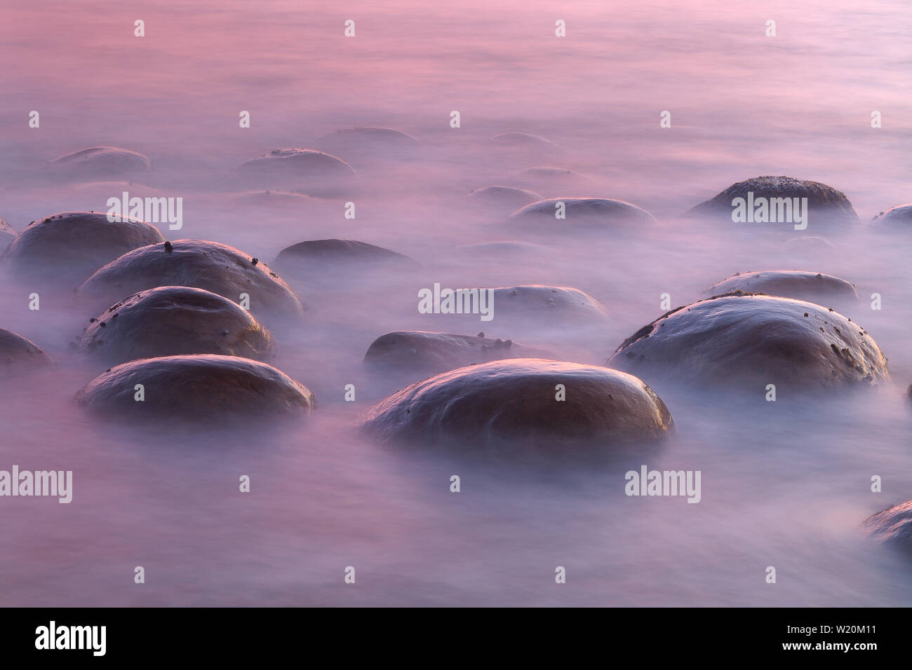 Twilight Wash on Submerged Concretions, Bowling Ball Beach, Mendocino County, California, USA Stock Photo