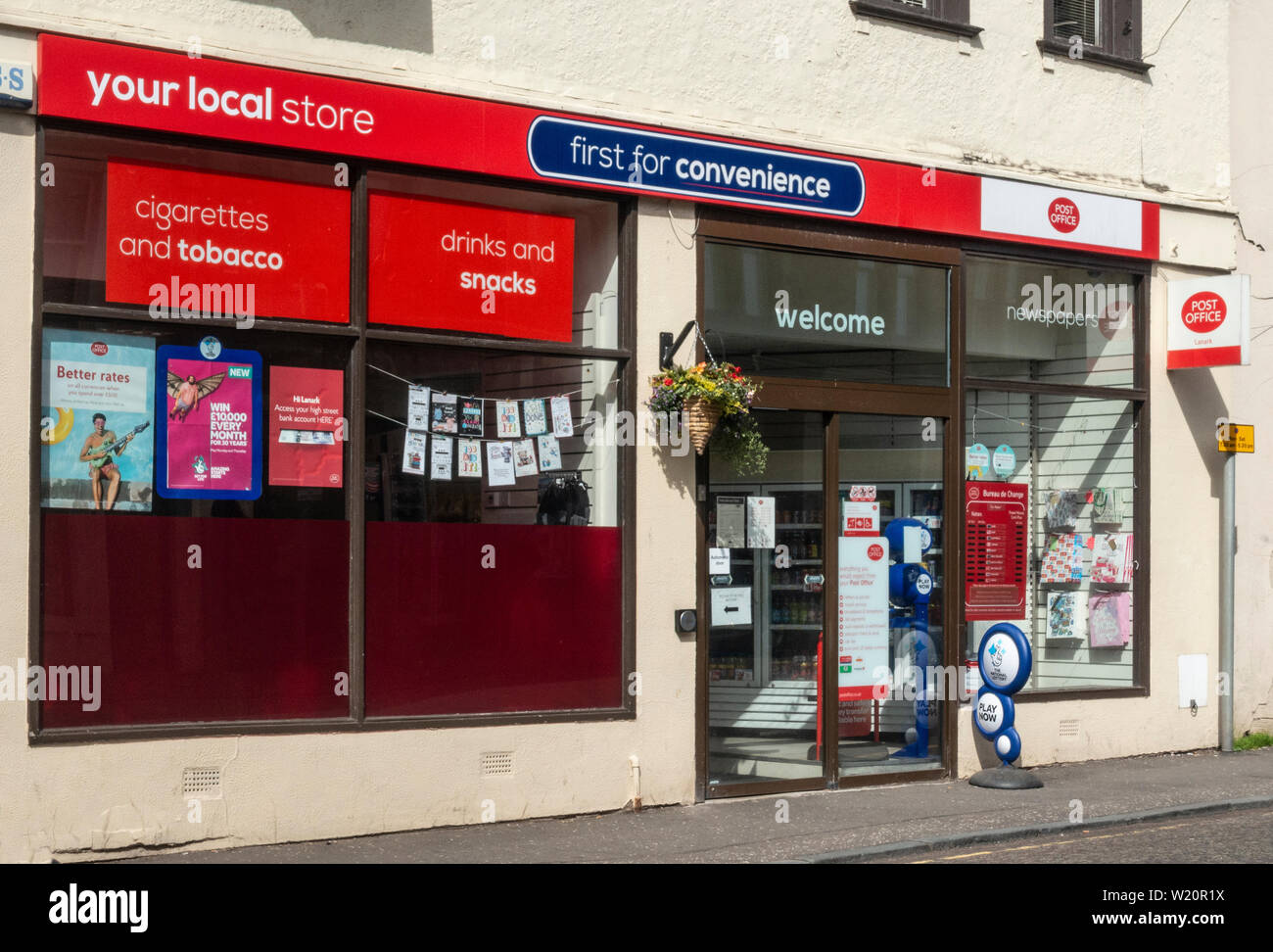 Exterior and entrance of First for Convenience, a small convenience store and post office in Lanark, Scotland Stock Photo