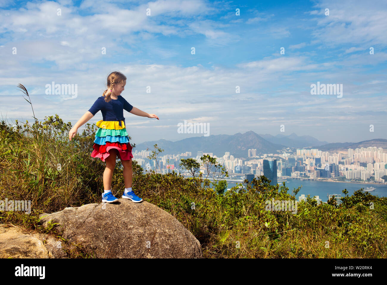 Family with kids hiking in Hong Kong mountains. Beautiful landscape