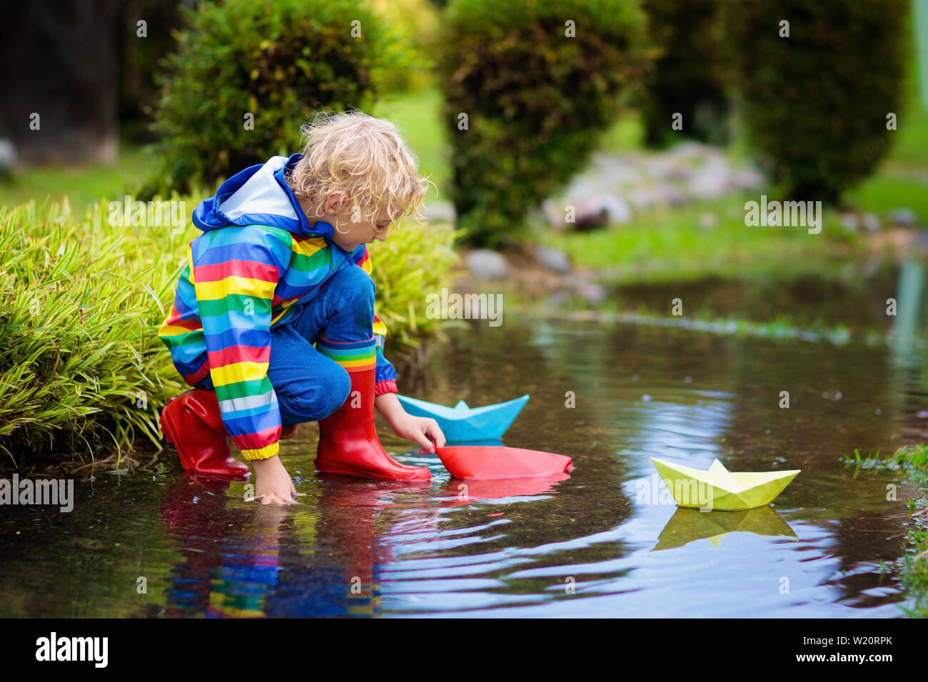 Boy paper boat hi-res stock photography and images - Alamy