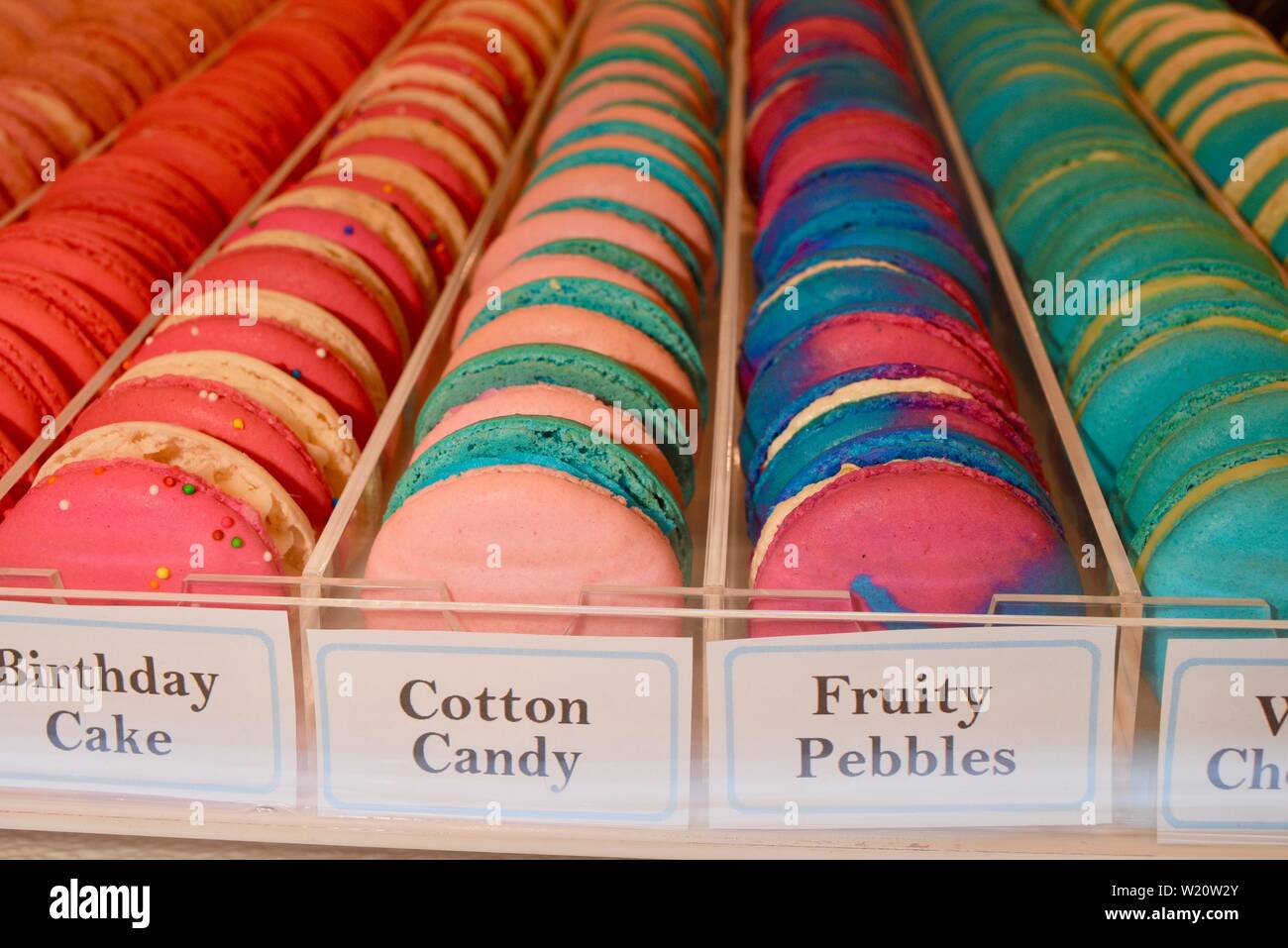 Rows of brightly colored French macarons from Le Petit Sucre on display