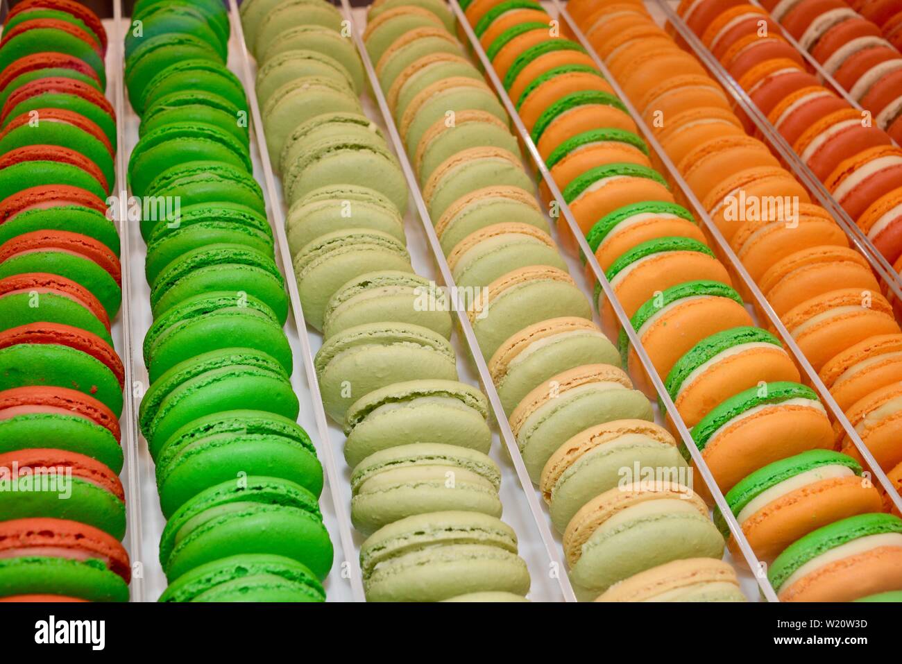 Rows of brightly colored French macarons from Le Petit Sucre on display