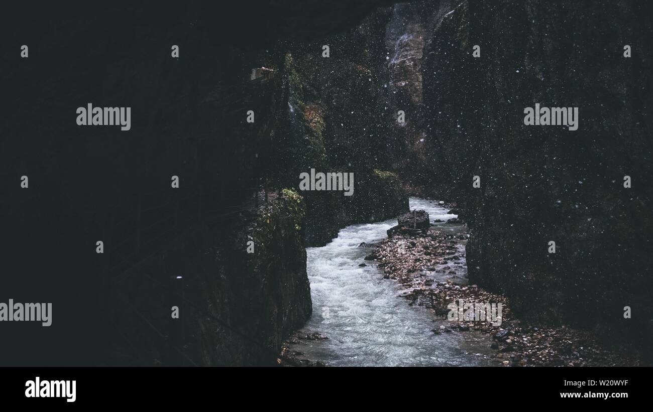 Narrow stream flowing through rocky formations Stock Photo - Alamy