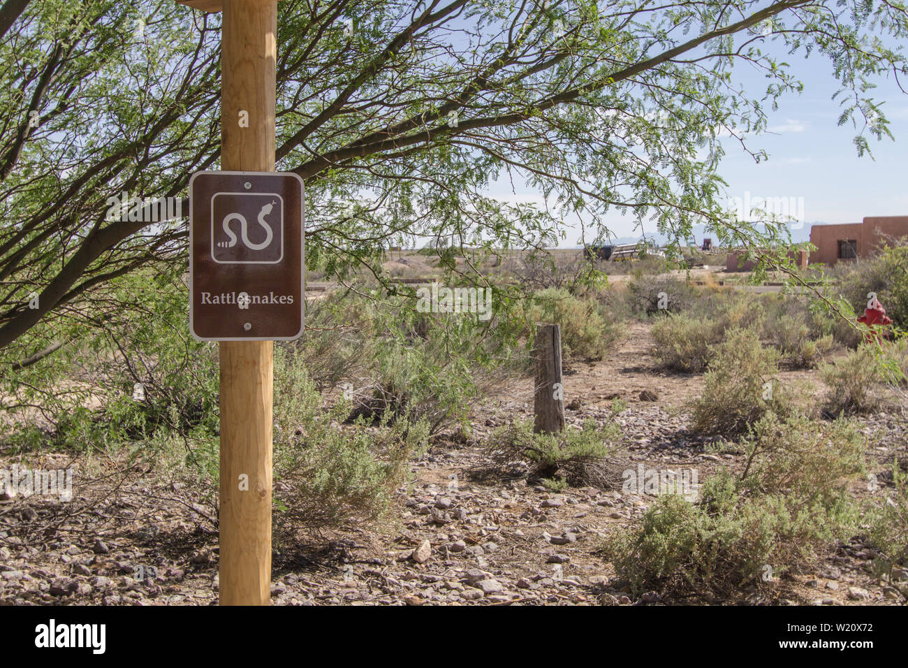 Sign warning of rattlesnakes at a national park picnic area in New Mexico. The American southwest is home to eight different species of rattlesnakes. Stock Photo
