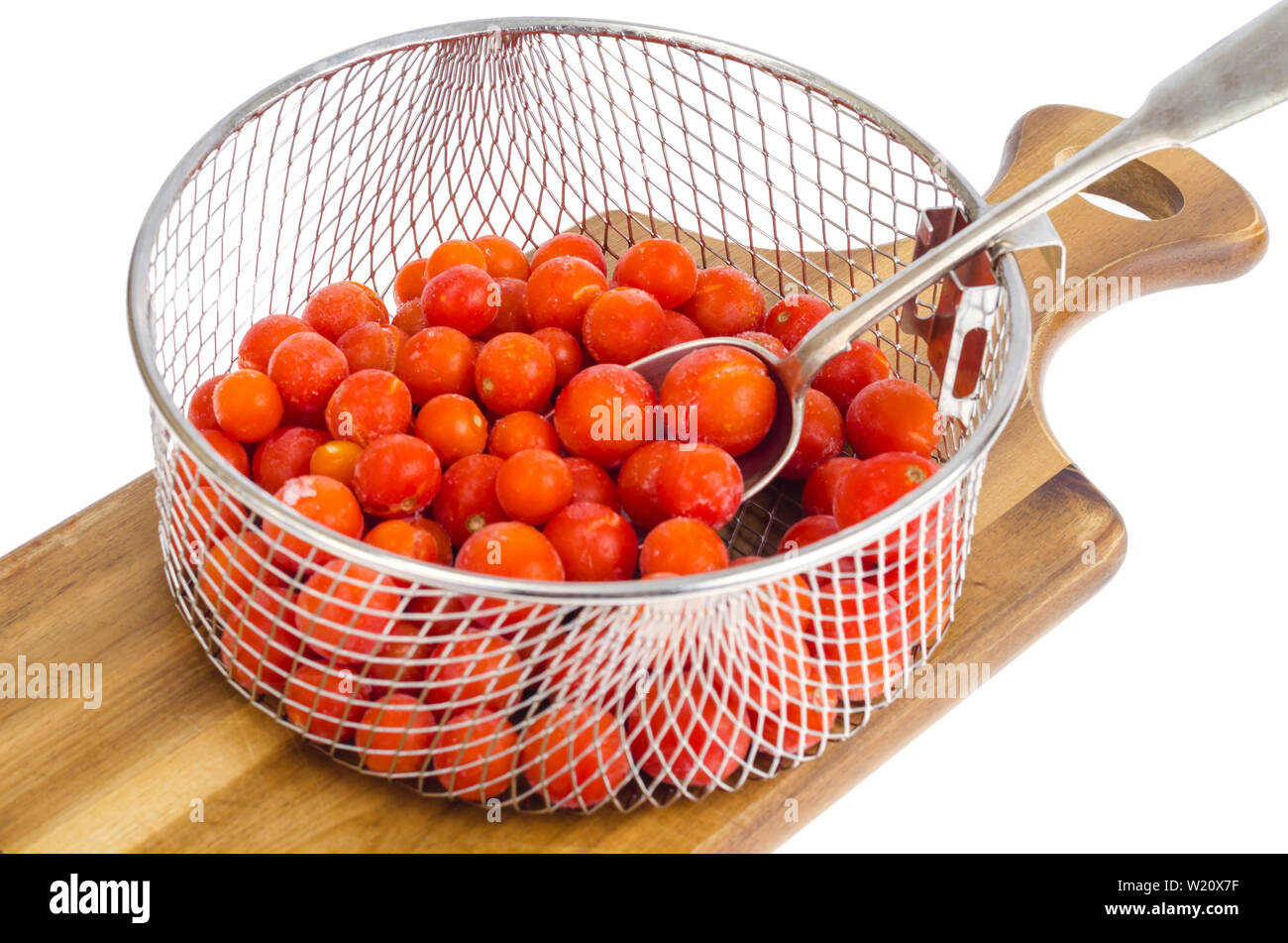 Tomatoes, frozen in refrigerator isolated on white Stock Photo Alamy