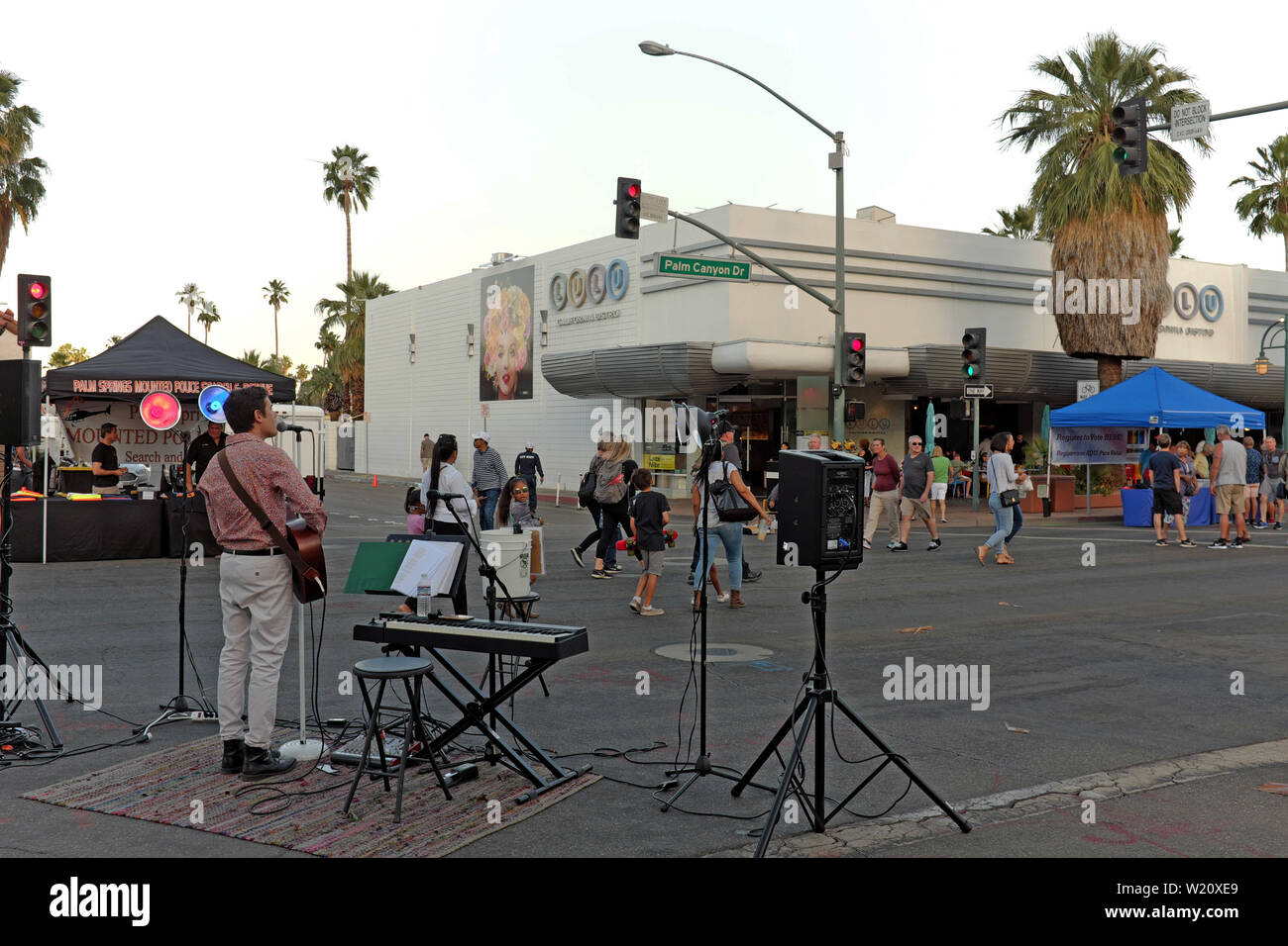 People enjoy the Villagefest in downtown Palm Springs, California. The Thursday night street fair features arts, crafts, food, and entertainment. Stock Photo