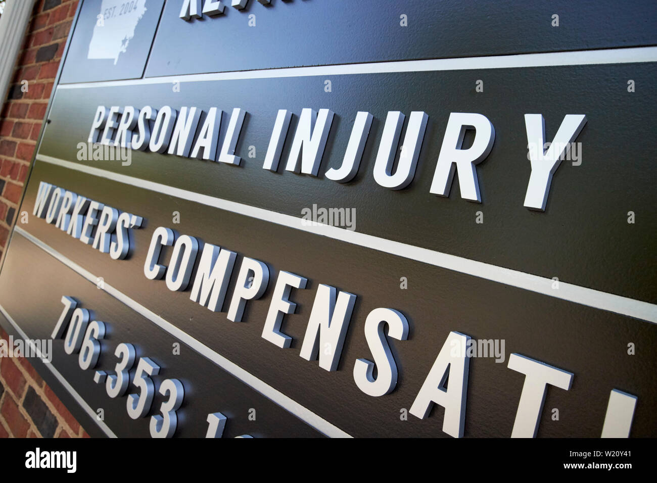 sign for personal injury and workers compensation outside a lawyers office Georgia USA Stock Photo