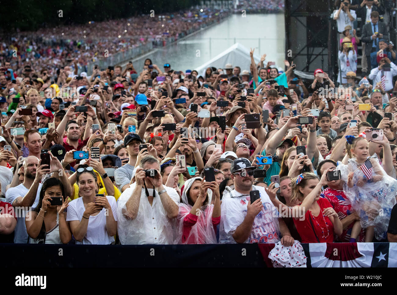 Attendees cheer as U.S. President Donald Trump speaks during the Fourth of July Celebration 'Salute to America' event in Washington, DC, U.S., on Thursday, July 4, 2019. The White House said Trump's message won't be political -- Trump is calling the speech a 'Salute to America' -- but it comes as the 2020 campaign is heating up. Credit: Al Drago/Pool via CNP/MediaPunch Stock Photo