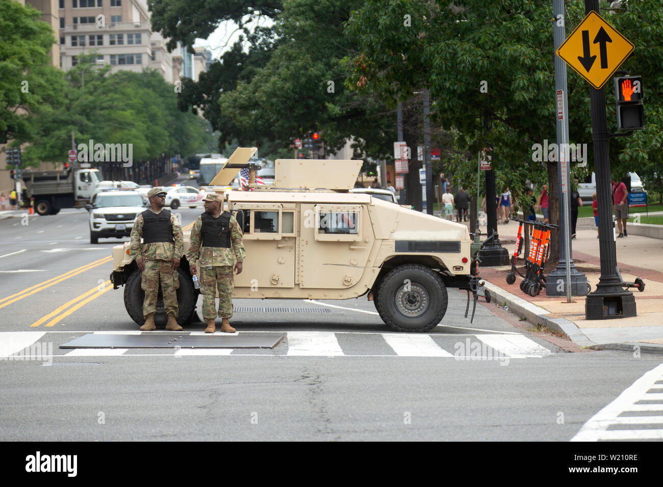 Military vehicles line the street prior to the