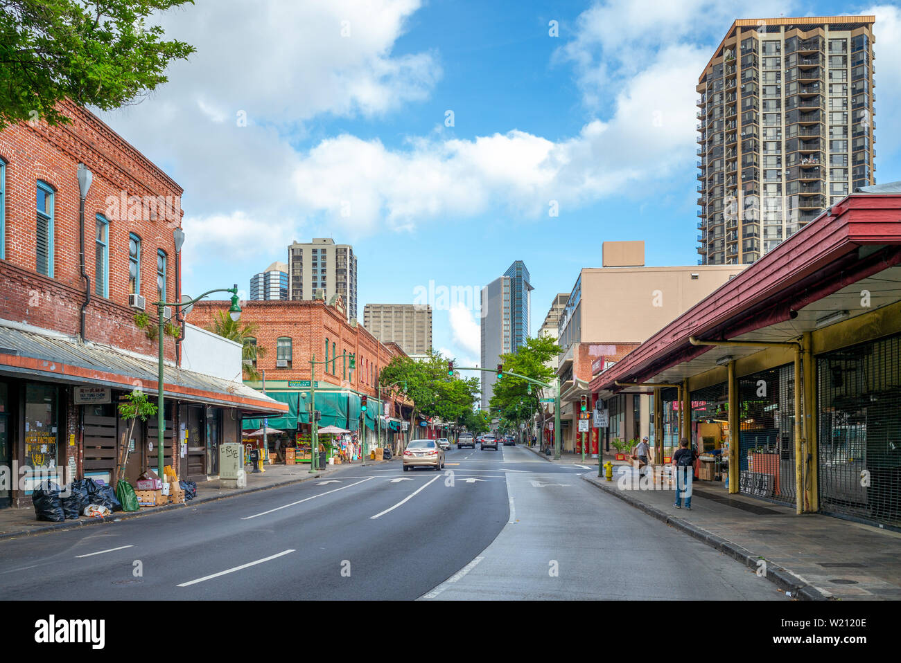 Honolulu, US - June 19, 2019: Street view of Chinatown in Hawaii. Laborers were imported from China to work on sugar plantations then moved to this ar Stock Photo