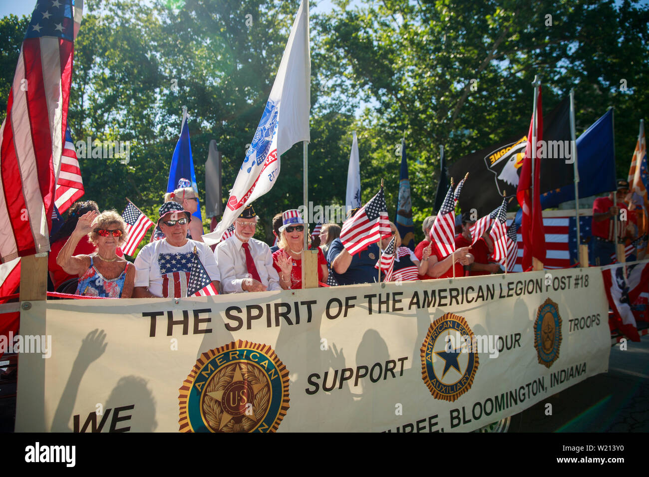 Members of the American Legion ride on a float during the Bloomington