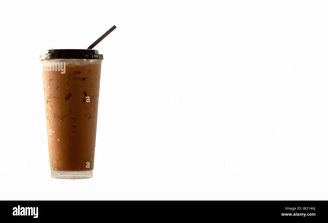 Iced coffee in a plastic glass on a white background. Stock Photo