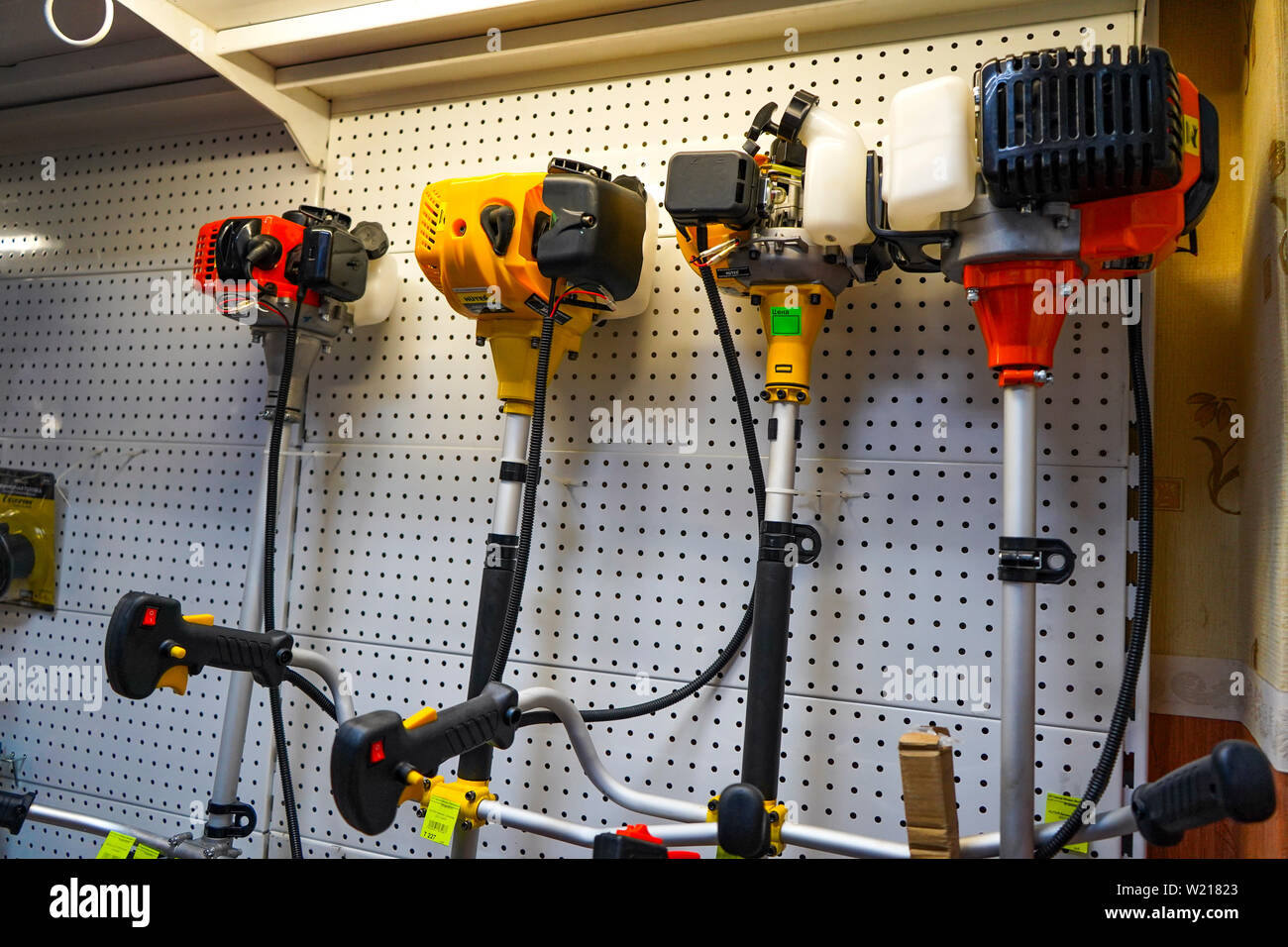 Chelyabinsk Region, Russia - JUNE 2019. Hardware store. Sale Electric trimmers for mowing lawns of various manufacturers in store. Stock Photo