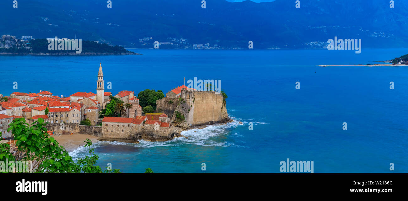 Panoramic view of Budva Old Town with the Citadel and the Adriatic Sea in Montenegro on the Balkans at sunset Stock Photo