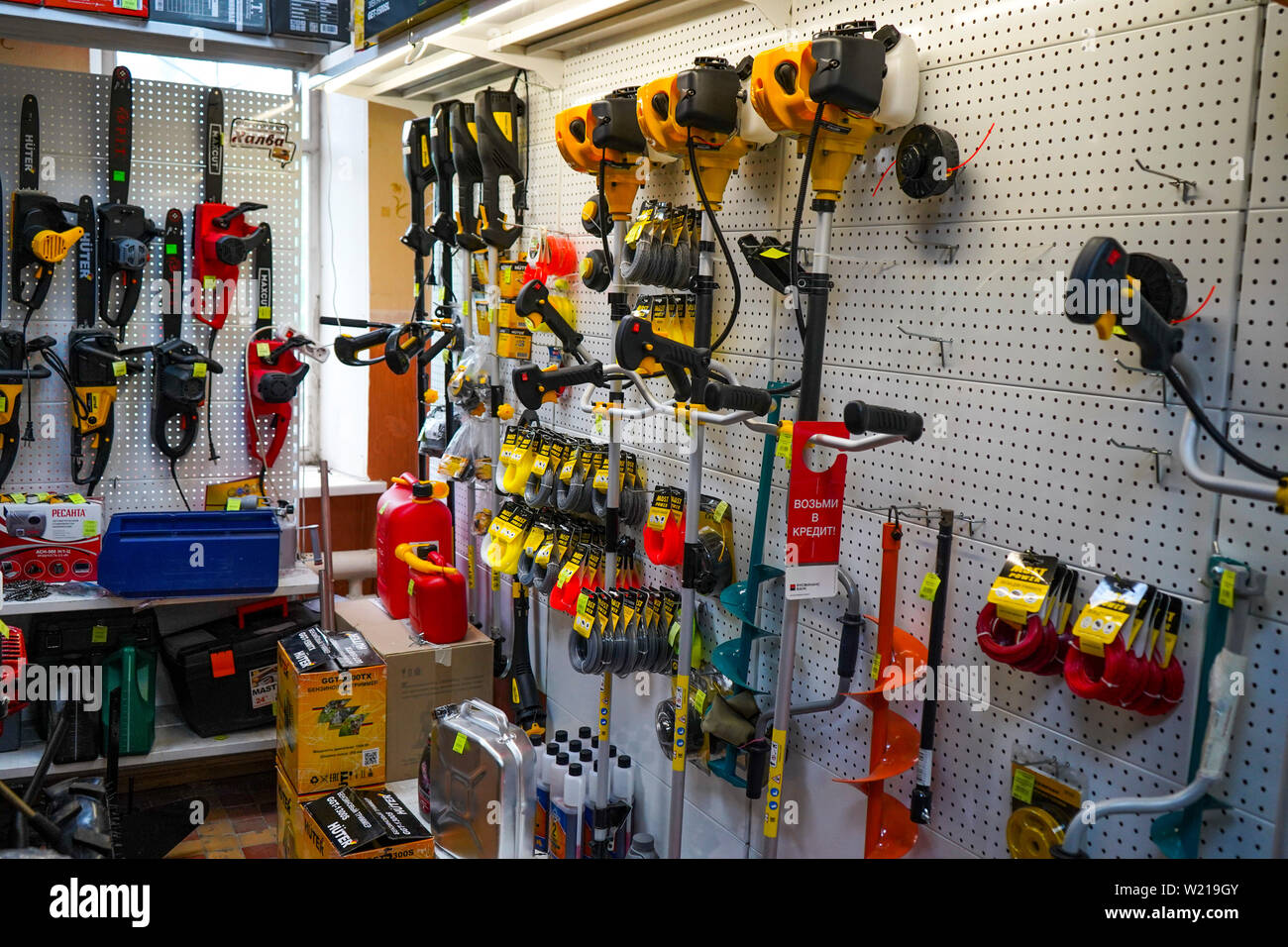 Chelyabinsk Region, Russia - JUNE 2019. Hardware store. Sale Electric trimmers for mowing lawns of various manufacturers in store. Stock Photo