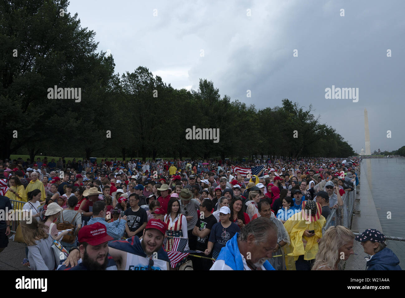 Washington, District of Columbia, USA. 4th July, 2019. Crowds gather in a stormy Washington, DC for United States President Donald J. Trump's Salute to America on July 4, 2019. Credit: Stefani Reynolds/CNP/ZUMA Wire/Alamy Live News Stock Photo