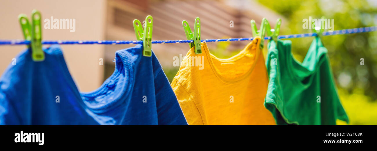 Multicolor Shirts On Clothesline In Sunny Day Banner Long Format