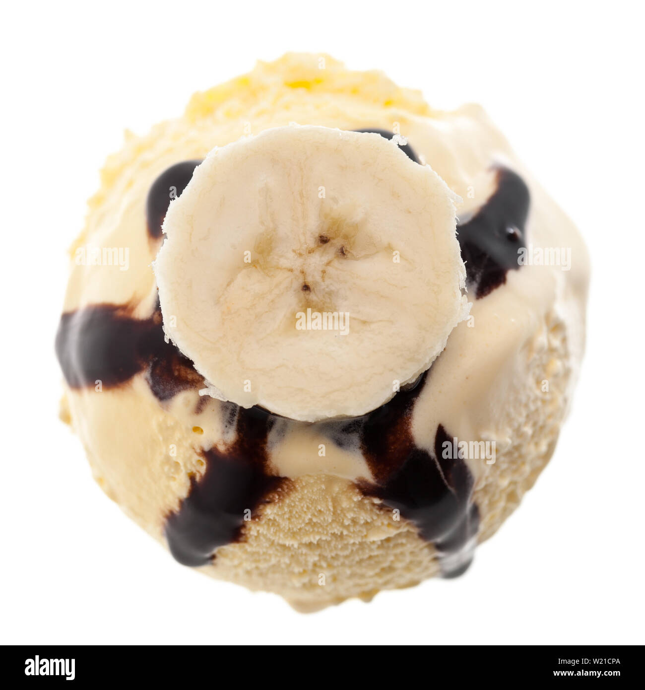 1 single banana ice cream scoop with chocolate sauce and banana slice isolated on white background Stock Photo