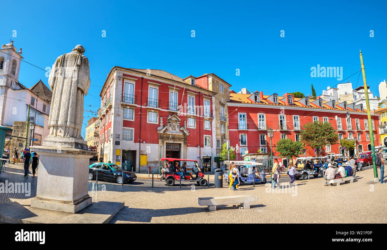 Tourists visiting to Largo Portas do Sol street in historic Alfama district. Lisbon, Portugal Stock Photo