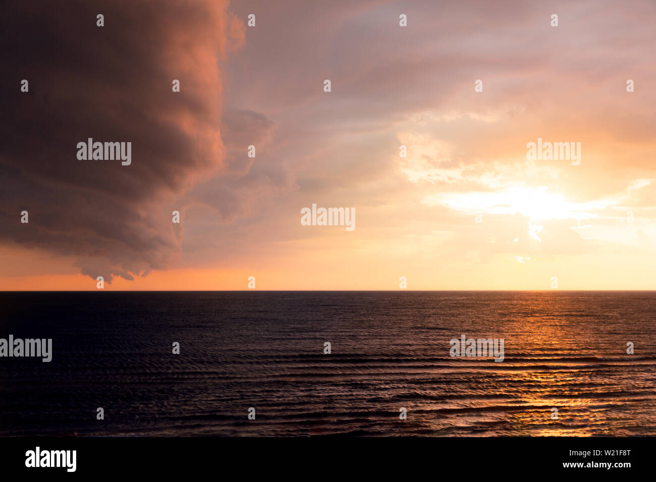 Dramatic sunset scene in the sea. Sea and sky sunset landscape Stock Photo