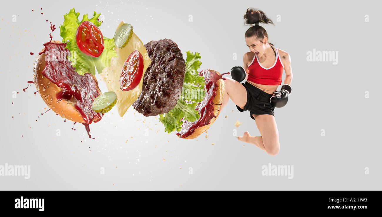 Running Chasing Burger String Fight the fast food. Burger's crashing by the boxer isolated on white ...