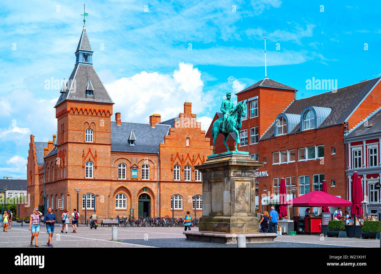 Esbjerg, Denmark - July 26, 2017:  Jutland peninsula,  ancient palaces and people walking in Torvet square with the equestrian statue of  Christian IX Stock Photo