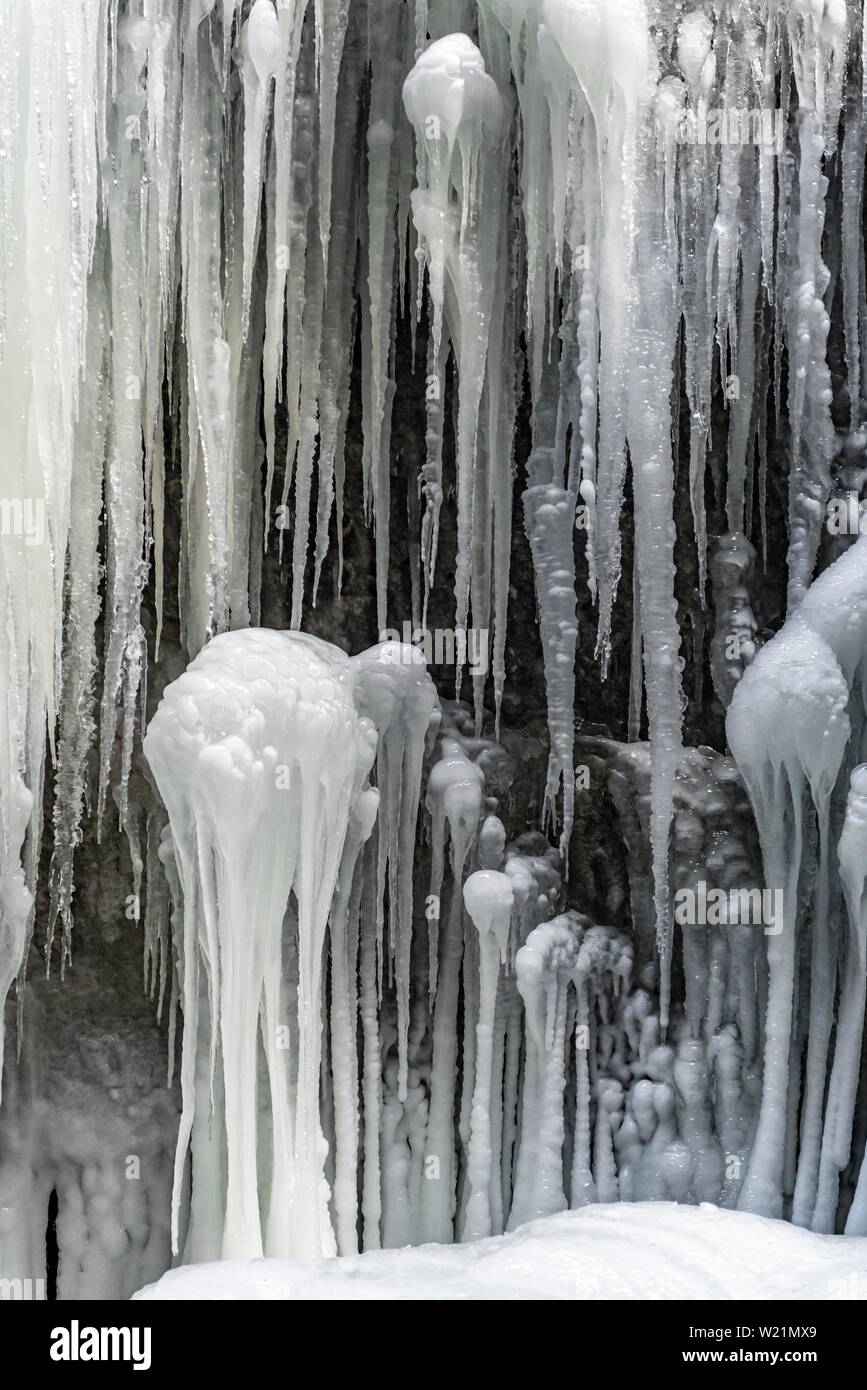 Long icicles on a rock face, Partnachklamm in winter, near Garmisch-Partenkirchen, Upper Bavaria, Bavaria, Germany Stock Photo