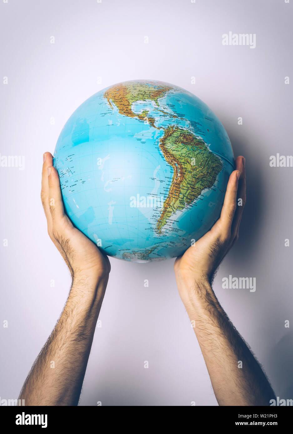 Save planet. Globe in the hands of young man. Save Earth concept. Stock Photo