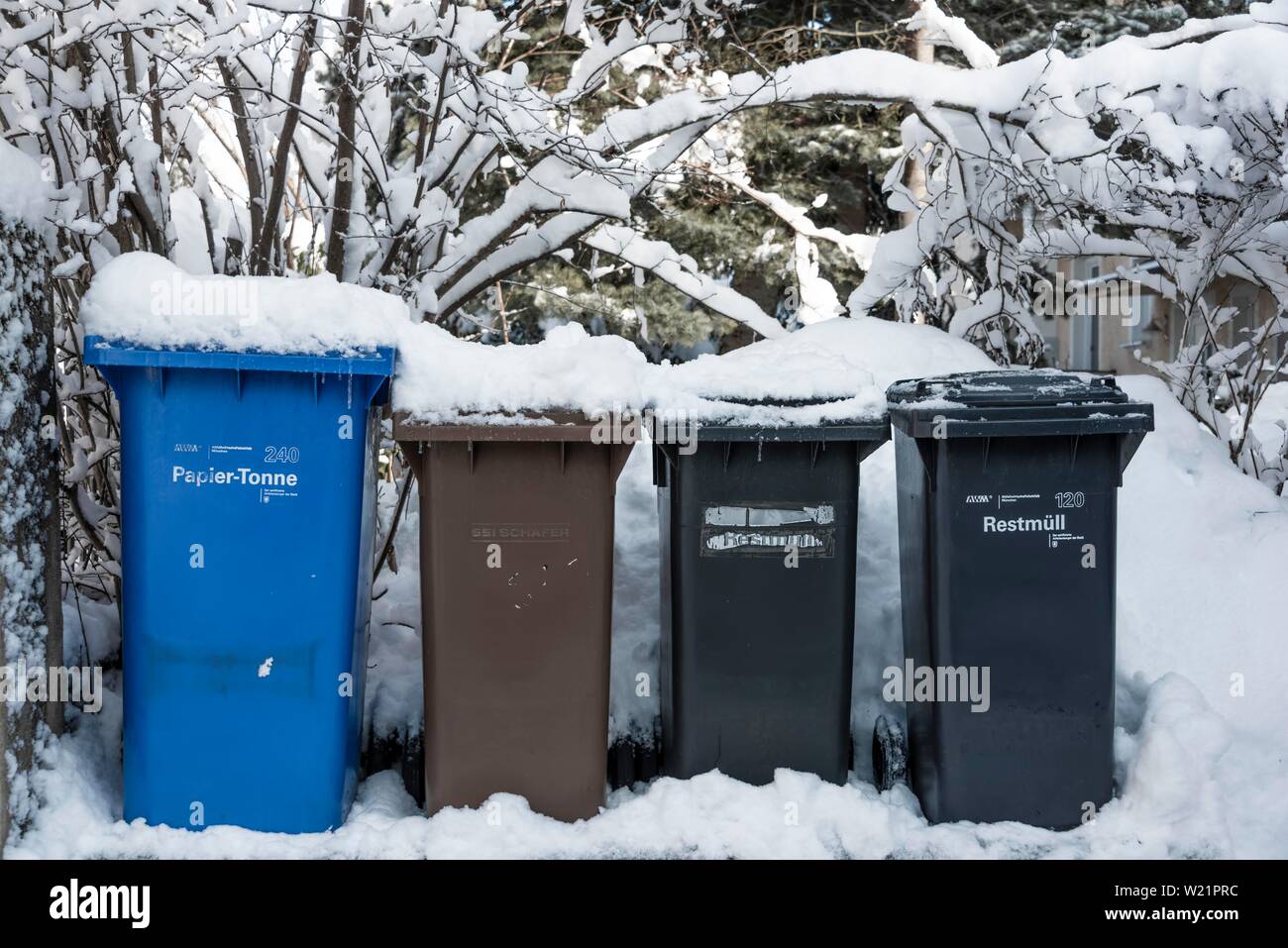 Paper bin, waste bin and bio bin, waste bins with snow, Munich, Upper Bavaria, Bavaria, Germany Stock Photo
