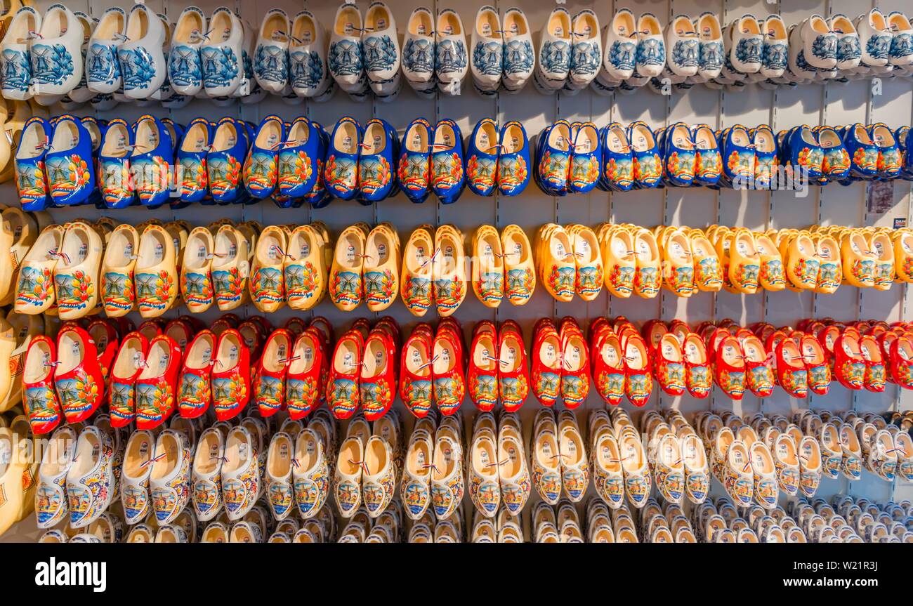 Traditionally colorfully painted Dutch wooden shoes on rack for sale, wooden clogs, Amsterdam, North Holland, Netherlands Stock Photo