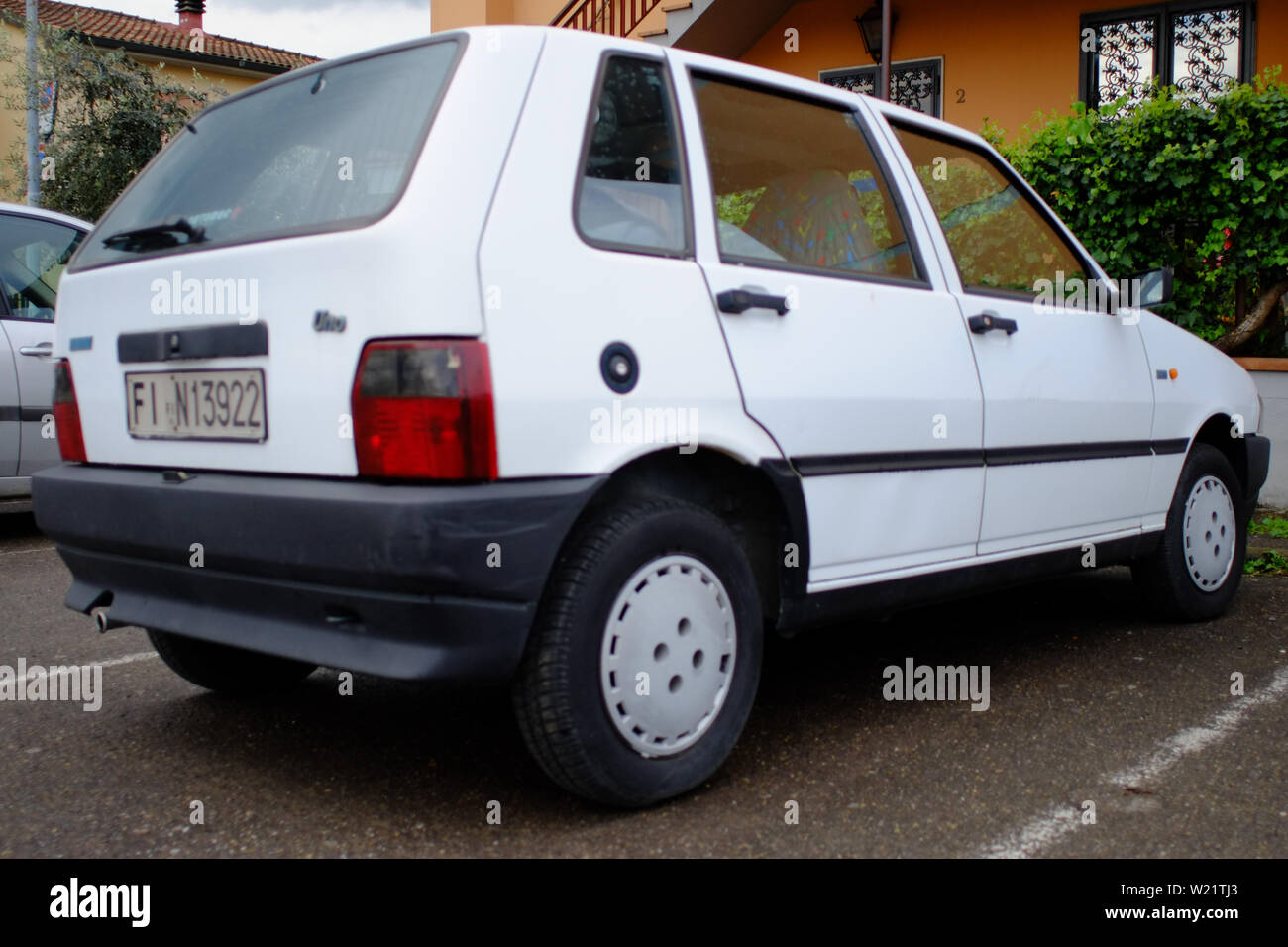 https://c8.alamy.com/comp/W21TJ3/vintage-white-fiat-uno-car-parked-in-a-urban-scenario-florence-italy-W21TJ3.jpg