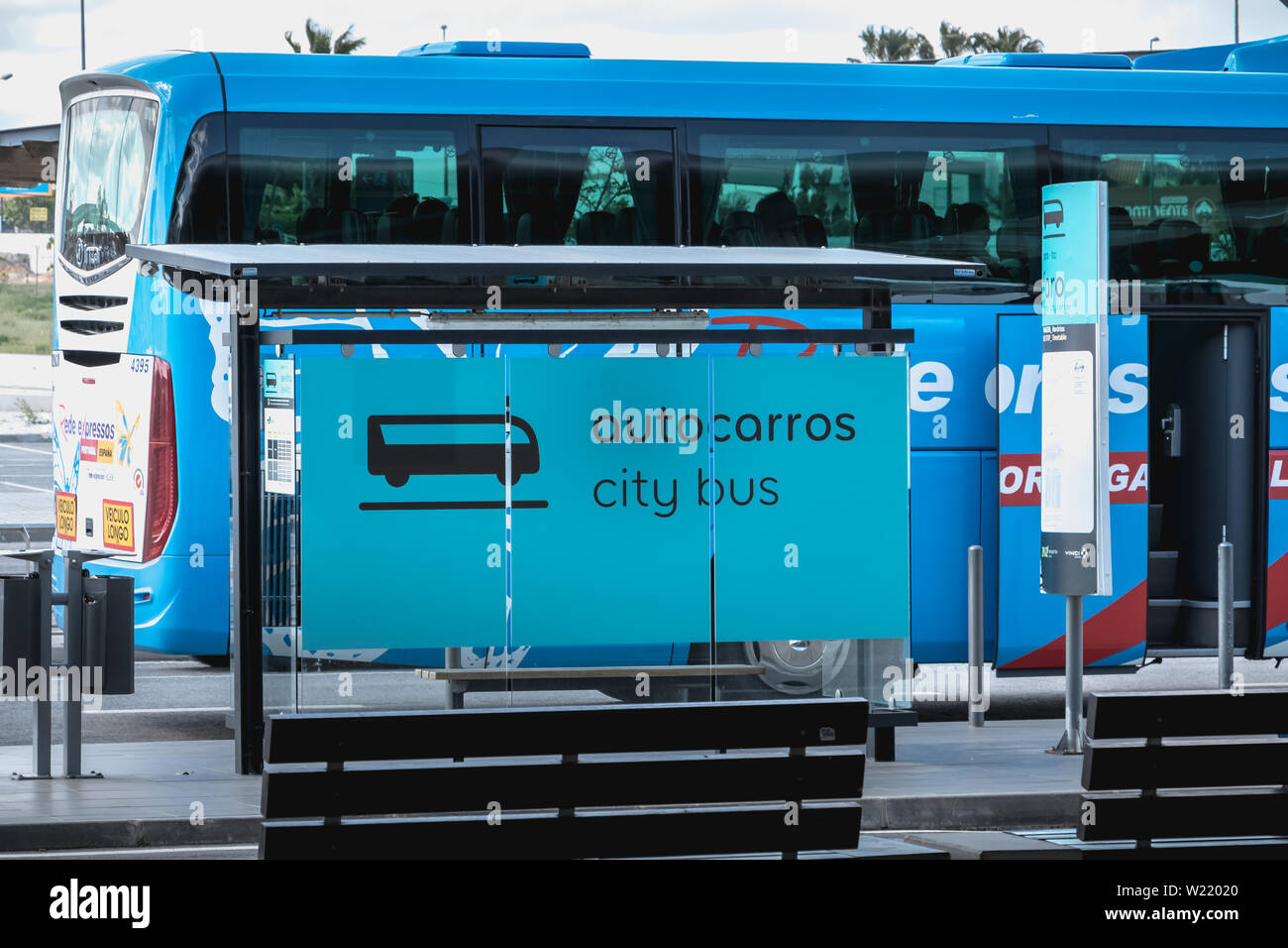Faro, Portugal - May 3, 2018: Passengers boarding a City-Bus bus in the car park of Faro International Airport on a spring day Stock Photo