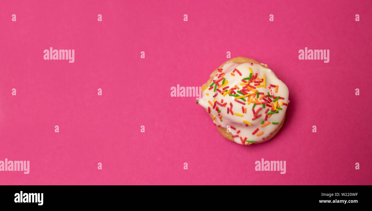 Creative flat composition food of sweet cake with multi-colored decoration Stock Photo