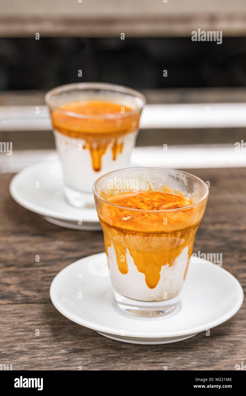 Signature coffee drinks made with cold cream and hot espresso Stock Photo