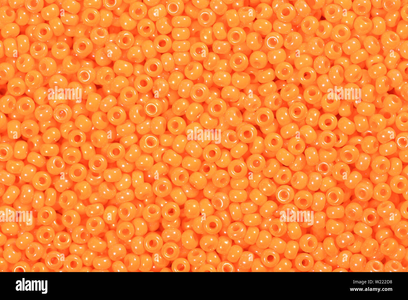 Bright orange seed beads. High quality texture in extremely high resolution. Stock Photo