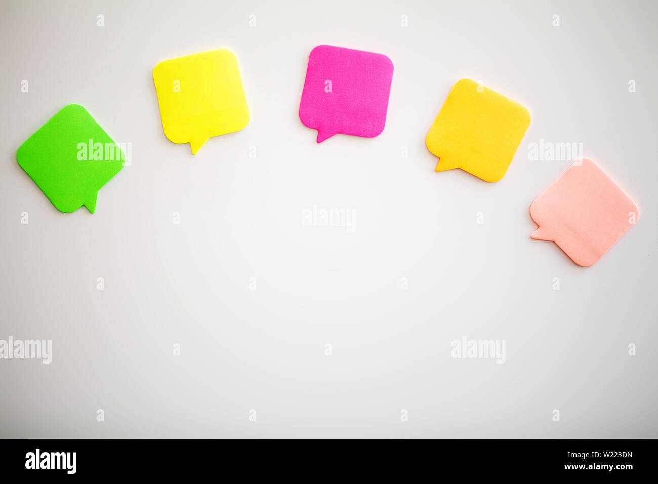 Colorful stickers on white wall. Empty Space for text Stock Photo - Alamy