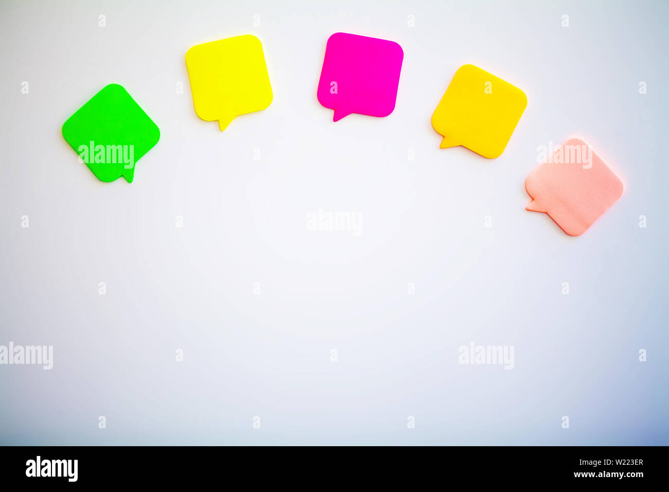 Colorful stickers on white wall. Empty Space for text Stock Photo - Alamy