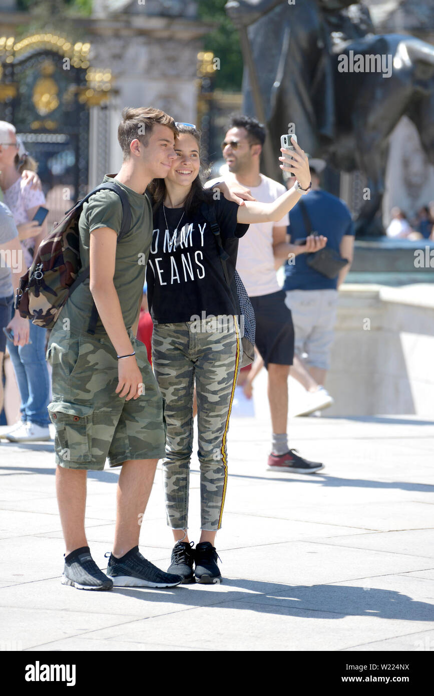 London, England, UK. Young couple taking a selfie on a sunny day in central London Stock Photo