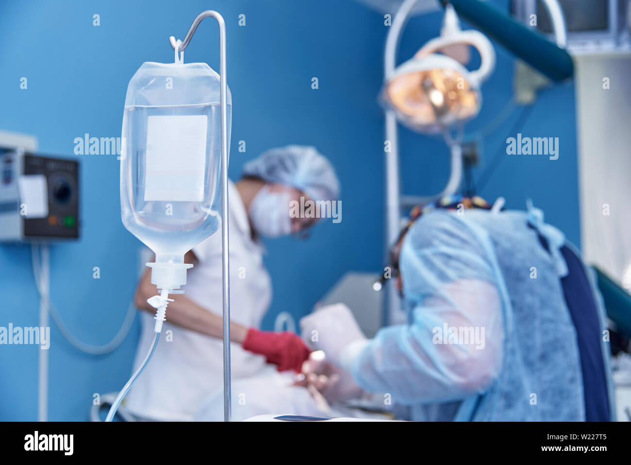 Dropper on a blurred background surgery at the dental clinic. Stock Photo