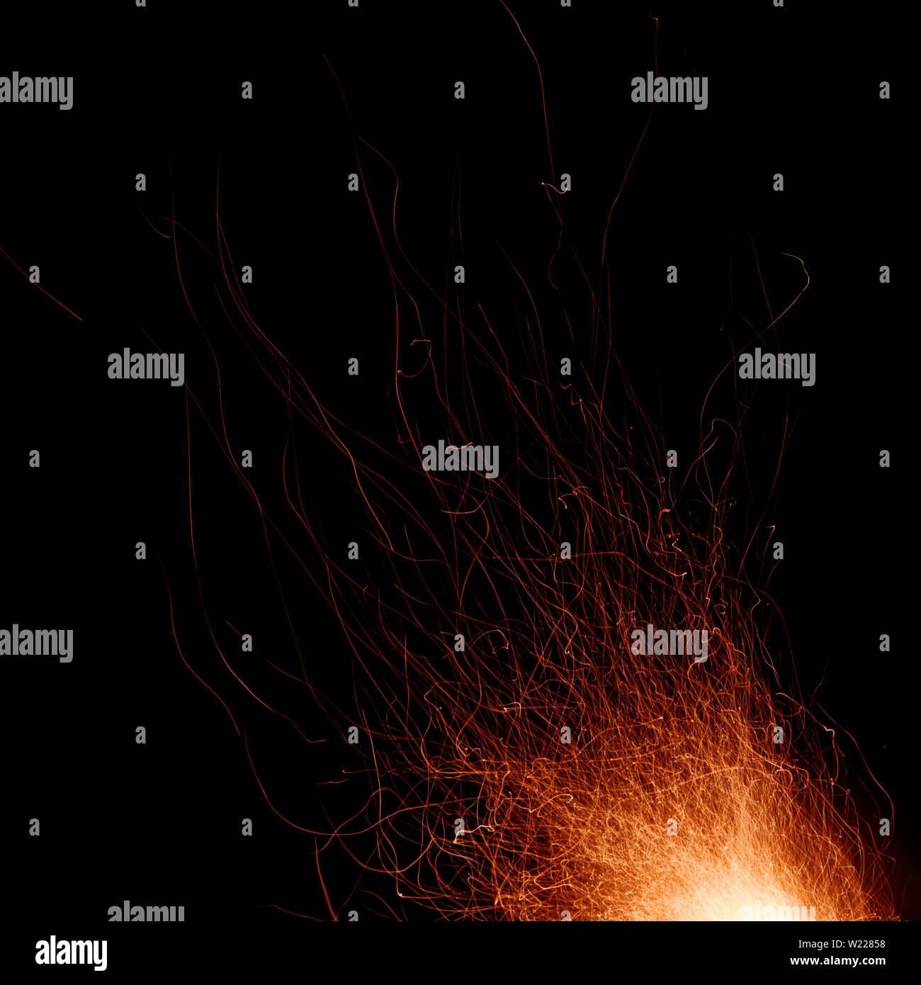 Abstract image of a fire sparks on a black background. Shot on a long exposure Stock Photo