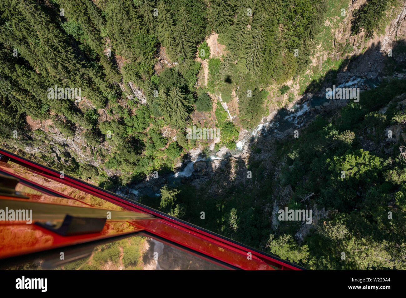 arial view into a wild gorge in the swiss alps Stock Photo