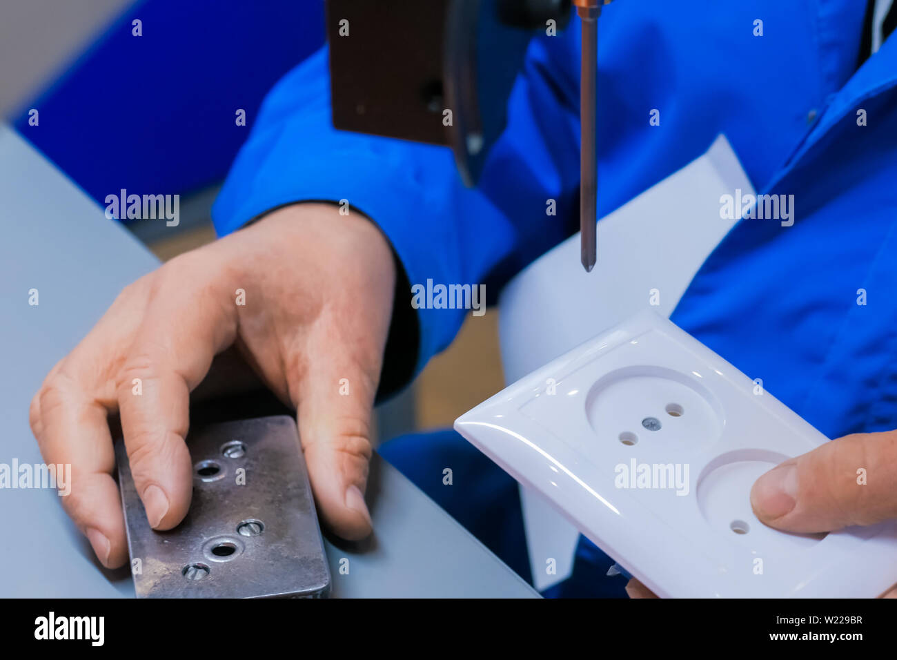 Electric socket handmade manufacturing process Stock Photo Alamy