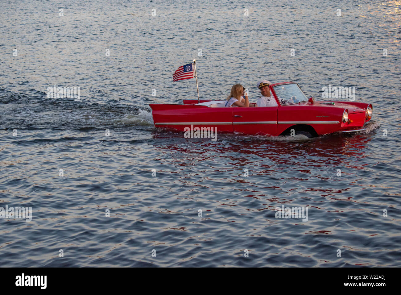 Orlando, Florida. June 15, 2019. People enjoying ride in vintage red amphicar at Disney Springs Stock Photo