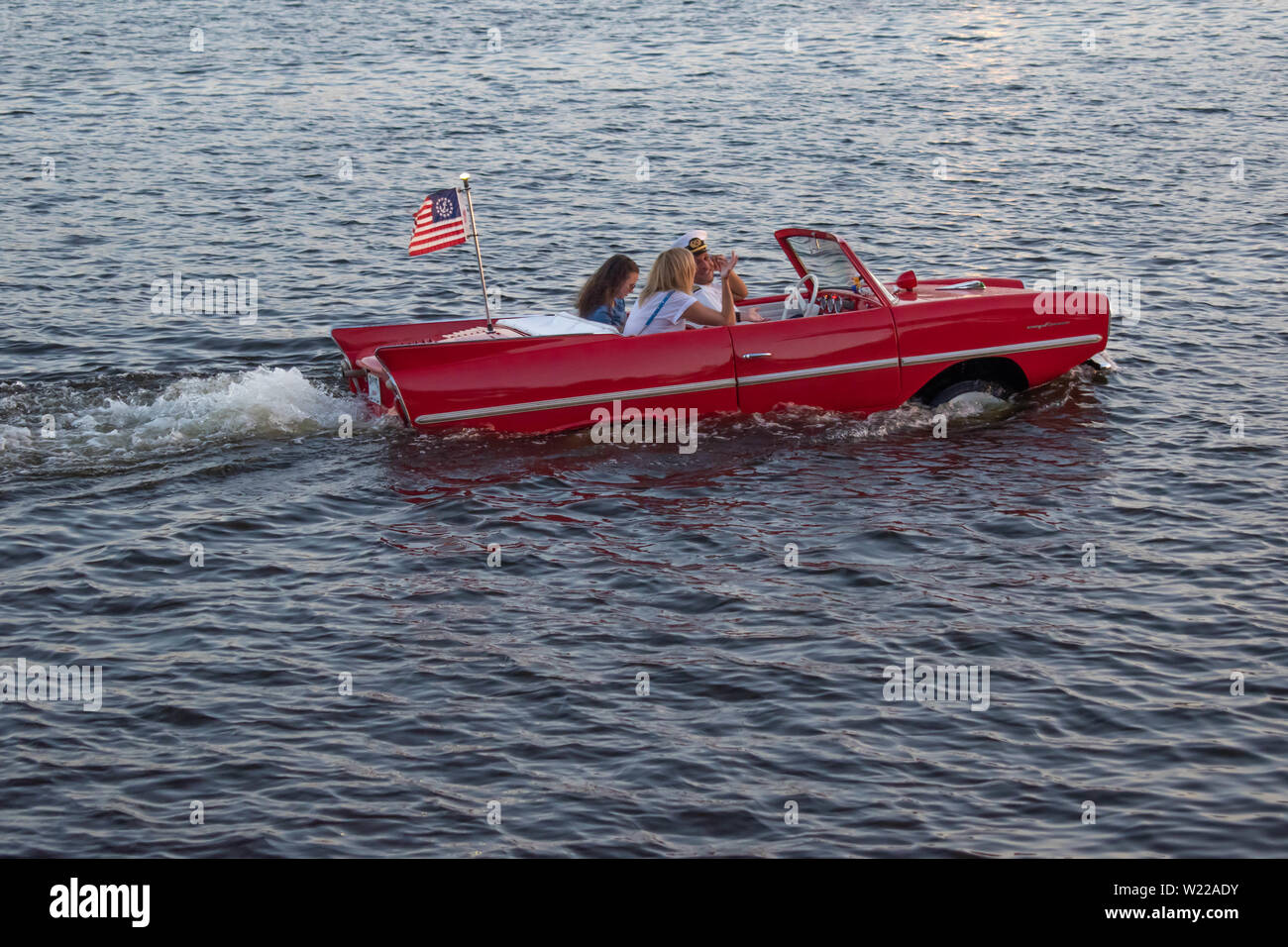 Orlando, Florida. June 15, 2019. People enjoying ride in vintage red amphicar at Disney Springs Stock Photo