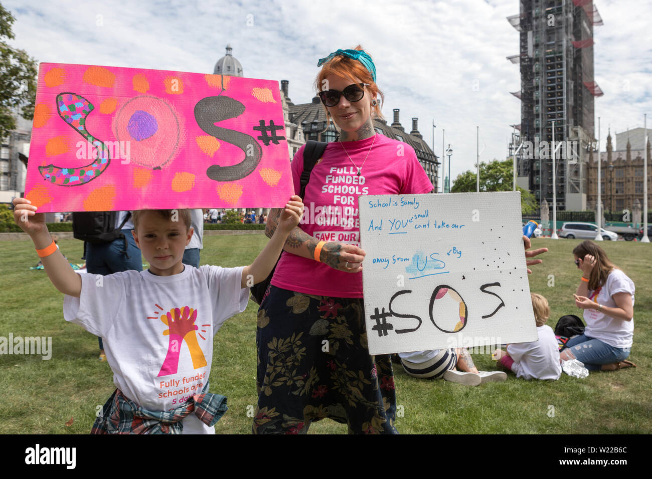 Parliament Square, London, UK. 5th July, 2019. Jess Phillips MP, parents and children protest over schools being forced to close early. The school Ms Phillips's children attend will be closing at lunchtime on Fridays from September because of funding cuts. Penelope Barritt/Alamy Live News Stock Photo