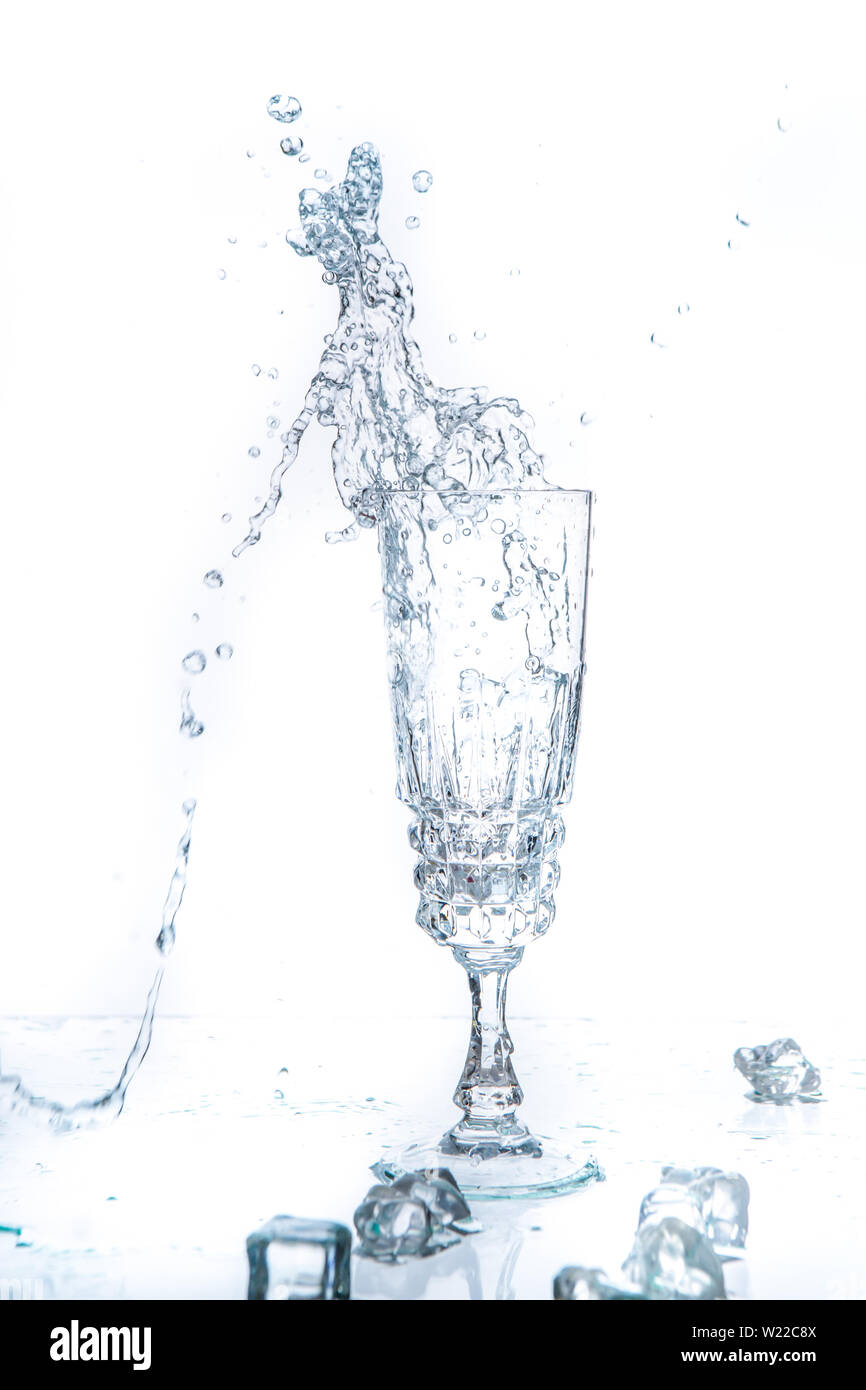 Glass of water and ice on a white background Stock Photo - Alamy