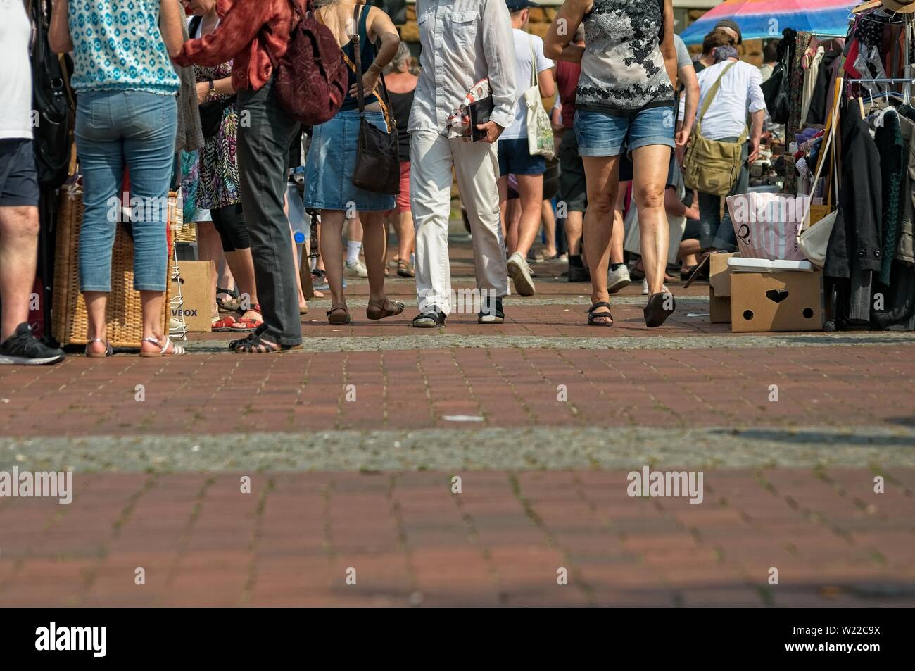 people at a weekend flea market on the streets with blurred background Stock Photo