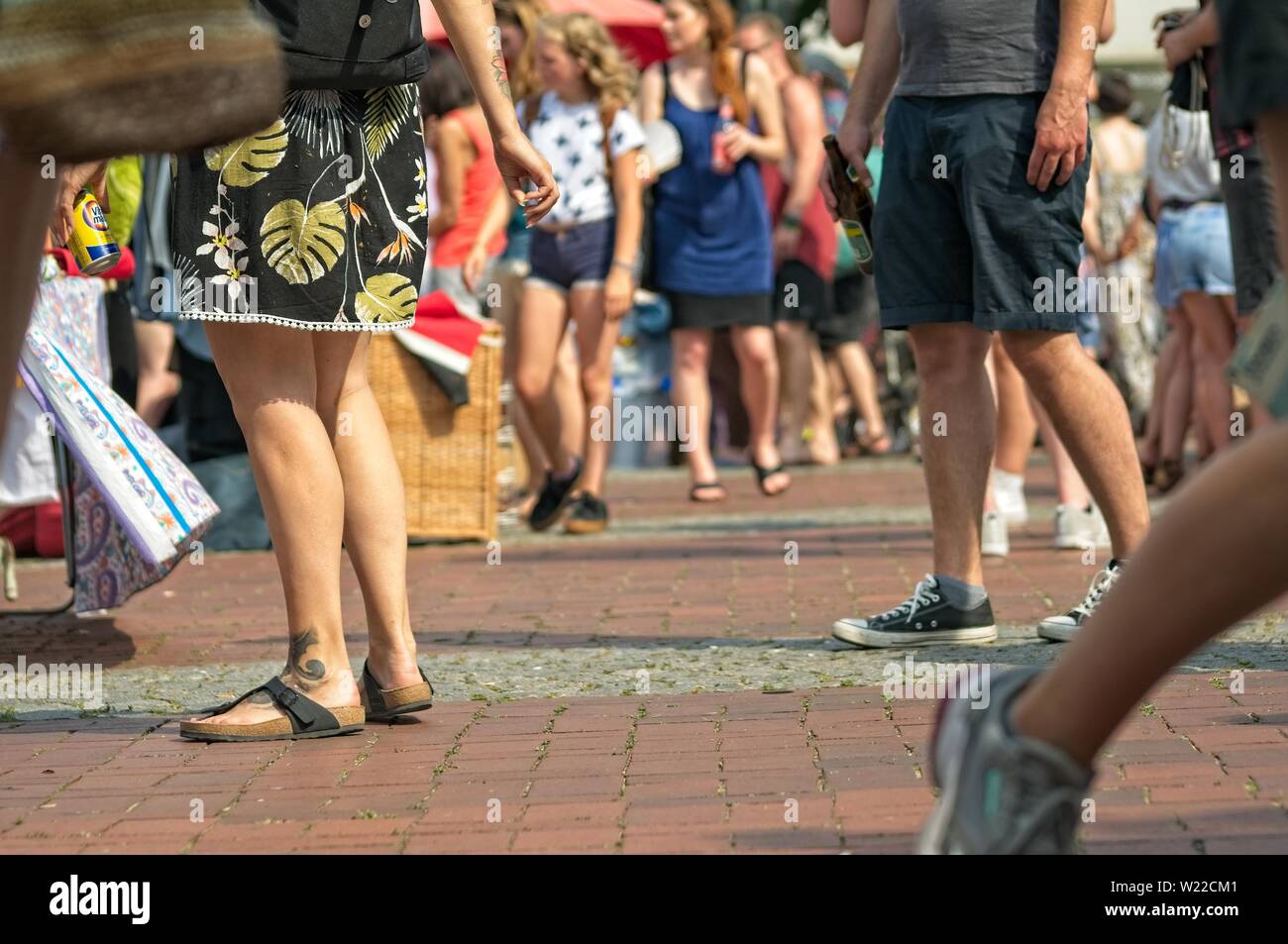 people at a weekend flea market on the streets with blurred background Stock Photo