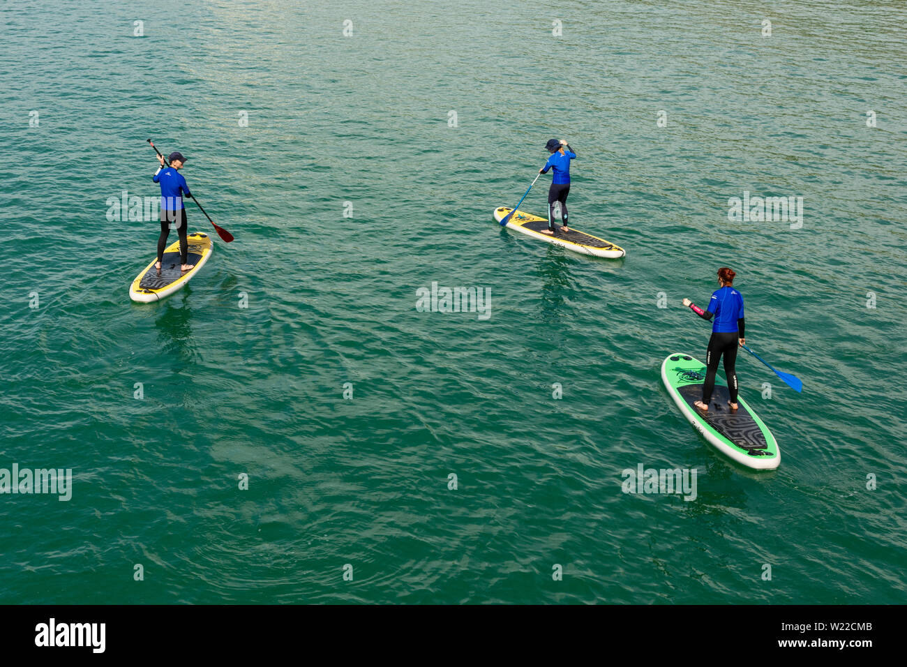 Boscombe, Bournemouth, Dorset, England, UK, 5th July 2019, Weather: Temperatures are on the rise Friday morning making this the warmest day of July so far in what will be a short lived heatwave. Paddle boarders are out early to enjoy the calm sea conditions. Credit: Paul Biggins/Alamy Live News Stock Photo