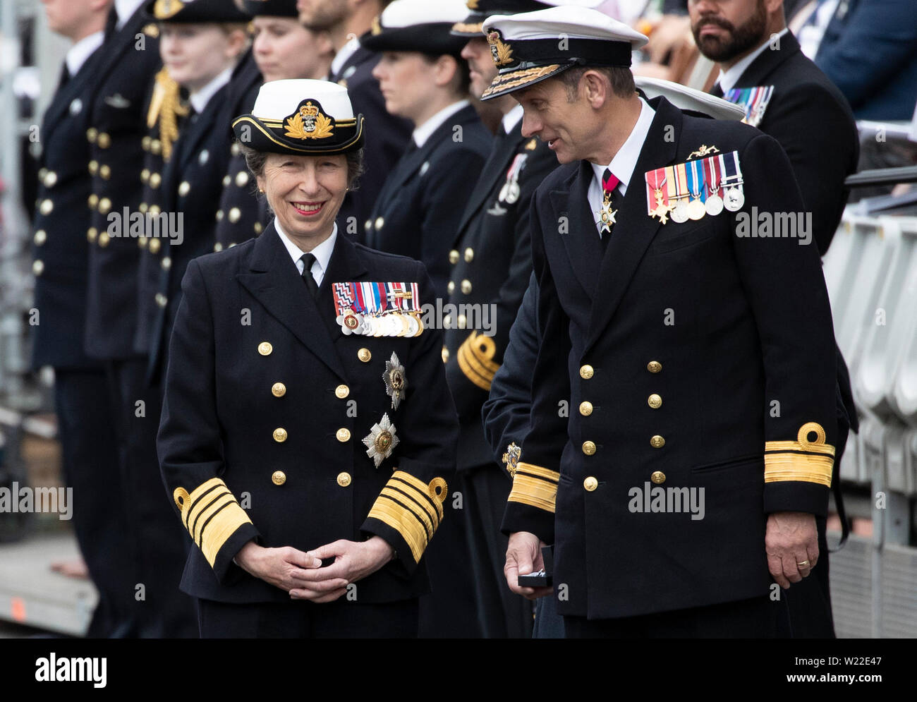 The Princess Royal and Rear Admiral John Weale (right) join serving Royal Navy submariners, veterans, families and support workers gather at HM Naval Base Clyde, the home of the UK Submarine Service at Faslane in Argyll and Bute, to mark 50 years of the Continuous At Sea Deterrent (CASD). Stock Photo